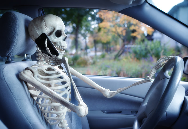 Skeleton on iPhone talking in car